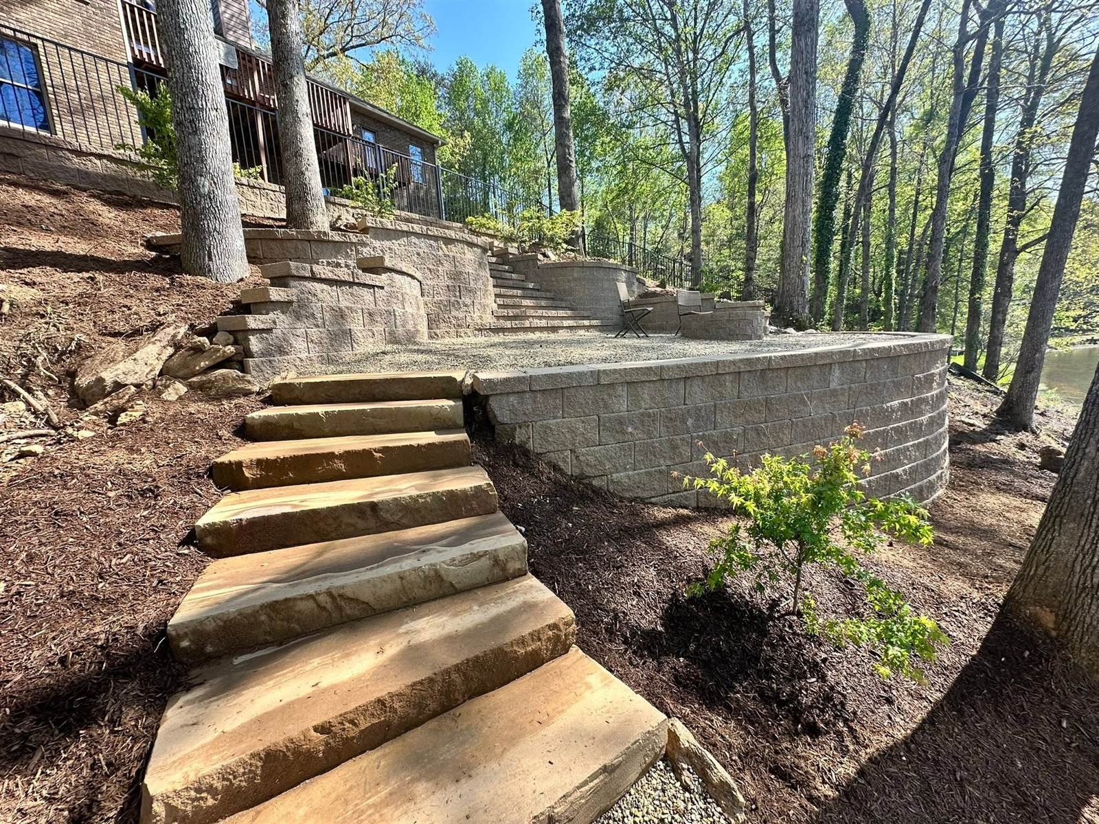 Natural stone steps through a curved retaining wall