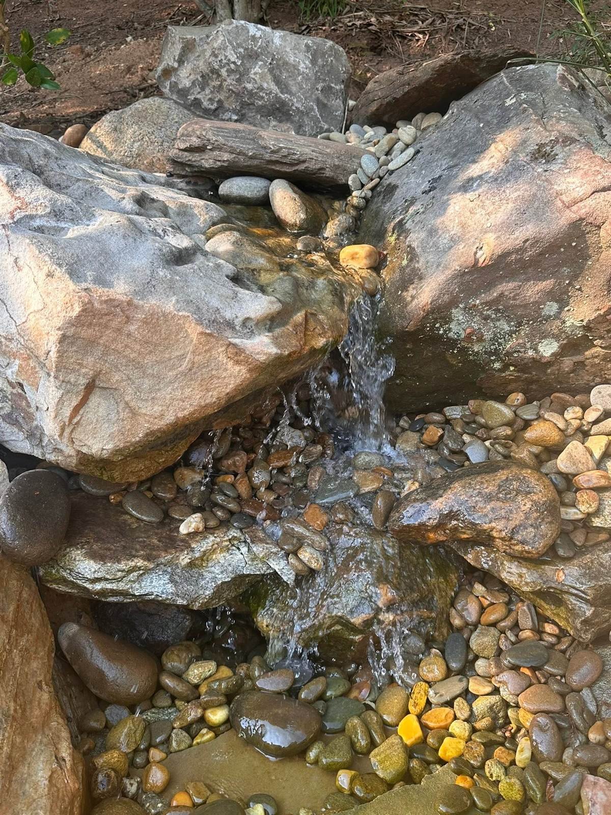 Close-up boulder waterfall with river rock