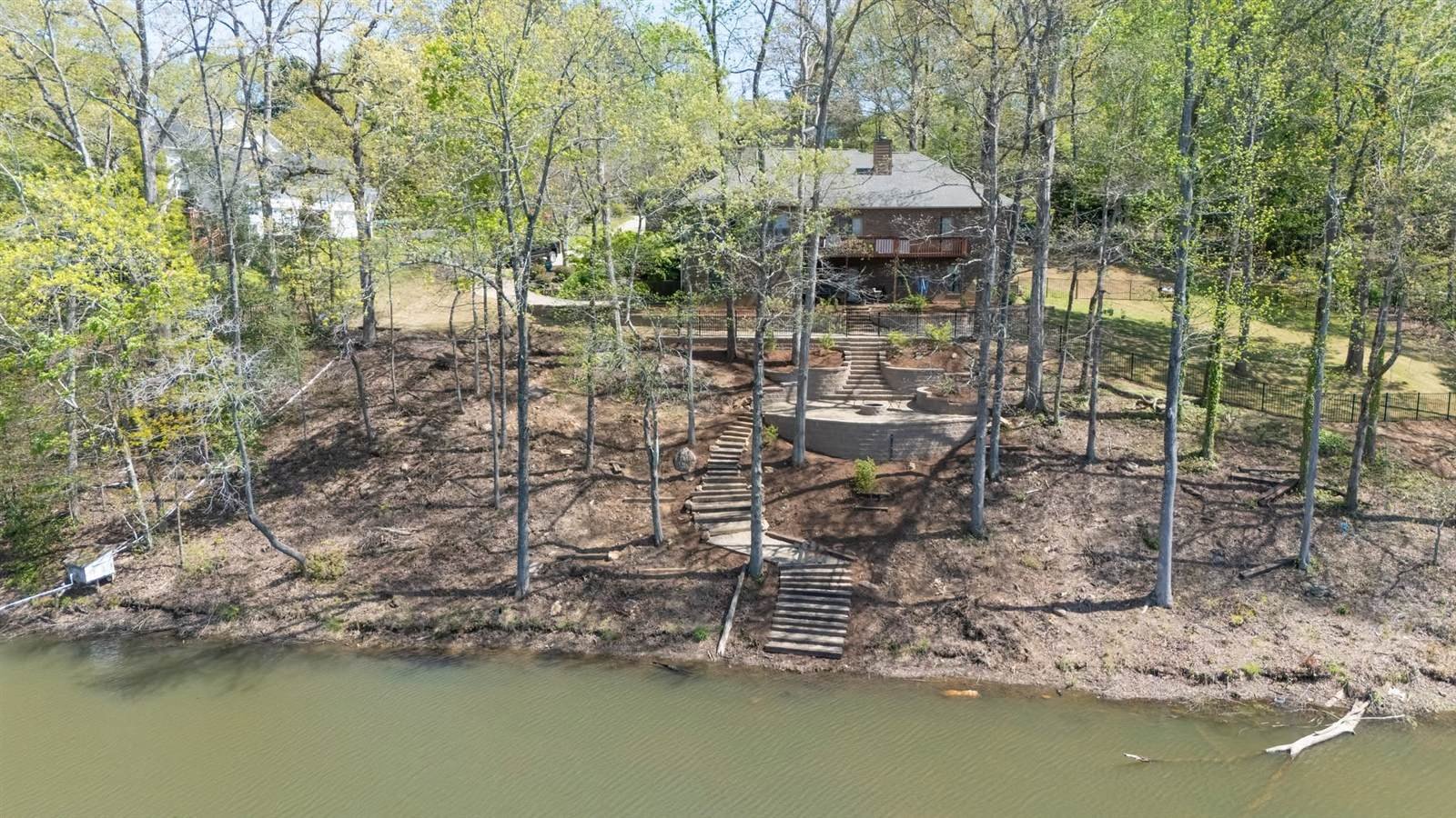 Aerial view of a Luxury Landscapes hardscape project on the shore of Lake Keowee